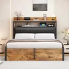 A bedroom scene featuring a bed with a headboard and storage. Voir les images du produit