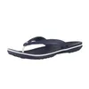 A single navy blue Crocs flip-flop is shown against a white background. Produktbild-Vorschau