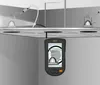 A device with a screen is shown attached to a ceiling, displaying an image of a kettle. Above the ceiling, there are pipes and what appear to be light fixtures. Náhled obrázku produktu