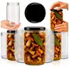 Several glass jars filled with pickled mushrooms and bay leaves, with an empty jar and a lid shown separately. Podgląd zdjęcia produktu