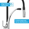 A close-up view of a kitchen faucet with a flexible hose and spray head, highlighting its magnetic holder and reach. Produktbild-Vorschau