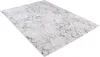 A rectangular rug with a distressed, abstract pattern is shown from a diagonal angle against a white background. Produktbild-Vorschau