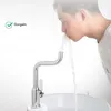 A man is drinking water directly from a faucet. Produktbild-Vorschau