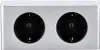 A close-up front view of a silver-colored power strip with two black electrical outlets. Produktbild-Vorschau