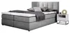 A bed with pillows and a blanket, next to a nightstand. Náhled obrázku produktu