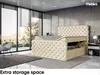 A modern bedroom with a tufted storage bed, large windows overlooking a landscape, and a chair. Produktbild-Vorschau