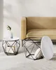 Two modern coffee tables with marble-look tops and geometric black metal bases are placed in a living room setting next to a tan sofa. Náhled obrázku produktu