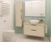 A clean and modern bathroom with a floating vanity, toilet, and a tall cabinet. Produktbild-Vorschau