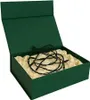An open green gift box with a cream-colored lining, containing a tangled black string of lights. Produktbild-Vorschau