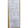 A piece of paper with text and diagrams, likely instructions or product information, attached to a brown cardboard surface. Produktbild-Vorschau