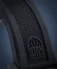 A close-up of a black watch strap with a textured pattern and a logo. Voir les images du produit