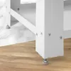 A close-up view of the base of a white washing machine or dryer stand, showing its adjustable feet and metal construction. Náhled obrázku produktu