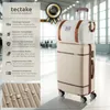 A luggage set consisting of a suitcase and a duffel bag, displayed in what appears to be an airport or large indoor public space. Produktbild-Vorschau