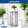 A modern interior scene with several white planters and a black metal plant stand holding a potted plant. Produktbild-Vorschau