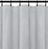 A close-up view of a gray velour curtain hanging from a black curtain rod. Produktbild-Vorschau