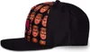 A side view of a black baseball cap with a pattern of Doom character faces on the front panel. Produktbild-Vorschau