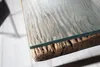 Close-up of a table edge showing the texture of the wood and the glass top. Produktbild-Vorschau