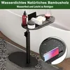A C-shaped side table with a tray holding toiletries and a drink, placed next to a bathtub. Produktbild-Vorschau