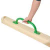 A hand holding a green climbing handle attached to a wooden beam. Voir les images du produit