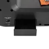 Close-up view of the back of a black sewing machine, showing the DC power input and foot pedal port. Náhled obrázku produktu