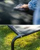 A person cleaning a pet bed and a close-up of the pet bed on grass. Anteprima dell’immagine prodotto