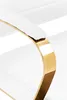 A close-up view of a white chair's armrest with a gold metal accent. Podgląd zdjęcia produktu