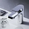 A close-up shot of a modern chrome faucet and a pop-up drain assembly on a white sink, with a gray textured wall in the background. Produktbild-Vorschau