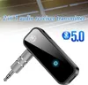 A black Bluetooth 5.0 audio receiver/transmitter with a silver 3.5mm jack is shown against a light gray and white background. Produktbild-Vorschau