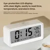 A digital alarm clock is shown on a surface, with marketing text above it. Produktbild-Vorschau