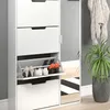 A white shoe cabinet with a mirrored door and a plant next to it. Produktbild-Vorschau
