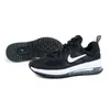 A pair of black Nike Air Max Genome GS sneakers with white accents, shown from a side and underneath view against a white background. Podgląd zdjęcia produktu
