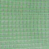 A close-up view of green greenhouse film with a grid pattern. Produktbild-Vorschau