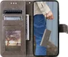 A person is holding a phone case with a phone inside, showing the product in use. Produktbild-Vorschau