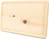 A close-up, top-down view of a wooden cutting board with a subtle groove around the edge. Produktbild-Vorschau