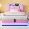 A pink upholstered bed with LED lighting and storage, set in a bedroom. Produktbild-Vorschau
