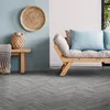 A living room scene with a sofa, bench, and wall decor. Produktbild-Vorschau