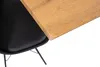 A close-up view of a table and a chair. Produktbild-Vorschau