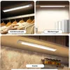 Collage showing LED under-cabinet lights installed in different locations: a closet, a bookshelf, and a kitchen. Produktbild-Vorschau