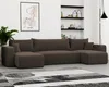 A large, U-shaped sofa is shown in a living room setting, with a rug in front and shelves on the wall behind. Voir les images du produit