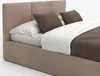 A bed with pillows and a blanket. Produktbild-Vorschau