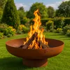A fire pit with burning logs in a garden setting. Produktbild-Vorschau