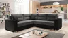 A modern living room with a sectional sofa, coffee table, and kitchen in the background. Podgląd zdjęcia produktu