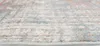 A close-up, angled view of a rug with a distressed pattern. Anteprima dell’immagine prodotto