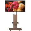 A TV stand with a screen displaying a floral image. Anteprima dell’immagine prodotto