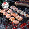 Shrimp and sausage are being grilled over hot coals. Náhľad obrázku produktu