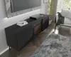 A modern living room with a TV stand featuring a fireplace, a sofa, and a rug. Podgląd zdjęcia produktu