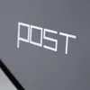 A close-up shot of the word "POST" written in white block letters on a dark gray textured surface. Produktbild-Vorschau