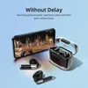A smartphone displaying a video game is placed next to a pair of black wireless earbuds and their transparent charging case. Podgląd zdjęcia produktu