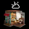 A miniature dollhouse cafe scene with a night sky overlay. Anteprima dell’immagine prodotto