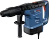 A blue and black Bosch rotary hammer drill is shown from a side-diagonal angle against a white background. Produktbild-Vorschau